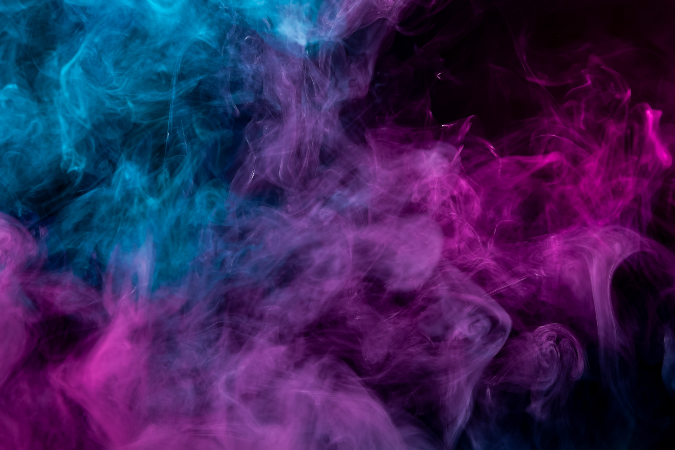 Pink and Blue Smoke on Black Background